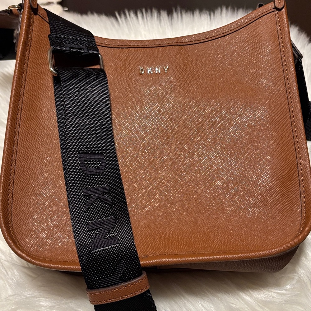 DKNY brown leather crossbody bag with a logo strap.